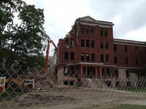 Morrill Hall being demolished by construction equipment 