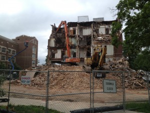 Morrill Hall being demolished by construction equipment 